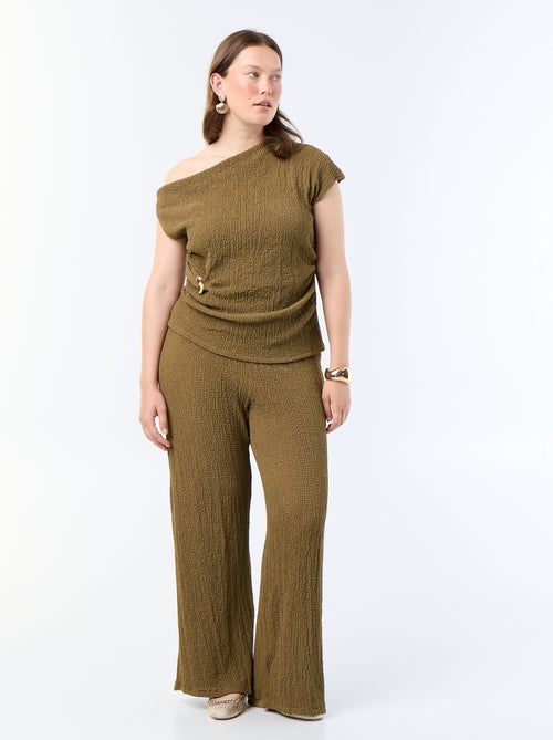 Asymmetrische top van crinkle-stof met goudkleurig sieraad - Kiabi Asymmetrische top van crinkle-stof met goudkleurig sieraad - Kiabi