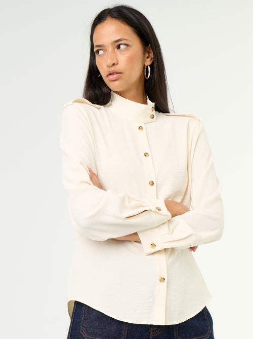 Blouse met hoge kraag en schouderstukken - Kiabi Blouse met hoge kraag en schouderstukken - Kiabi