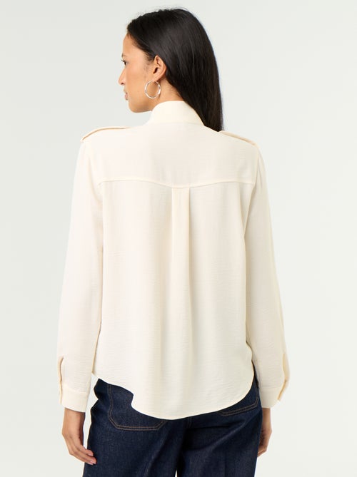 Blouse met hoge kraag en schouderstukken - Kiabi Blouse met hoge kraag en schouderstukken - Kiabi