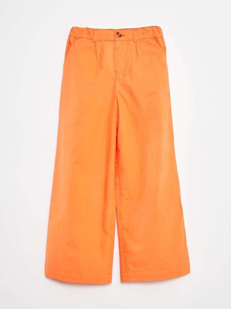 Een kleurrijke broek met wijde pijpen Oranje - Kiabi