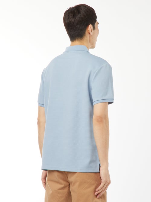 Een polo met wafeltextuur en ritsje aan de hals! - Kiabi