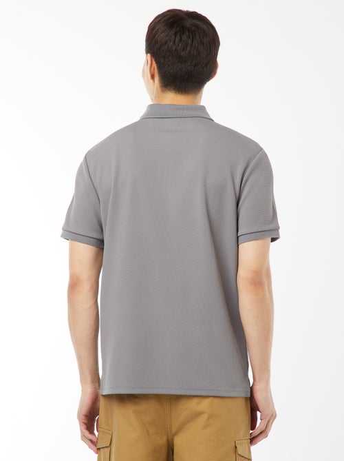 Een polo met wafeltextuur en ritsje aan de hals! - Kiabi