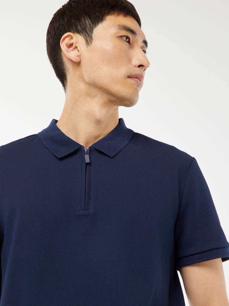 Een polo met wafeltextuur en ritsje aan de hals! ZWART - Kiabi