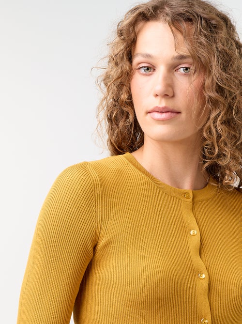 Effen geribbeld vest met ruchesafwerkingen - Kiabi Effen geribbeld vest met ruchesafwerkingen - Kiabi