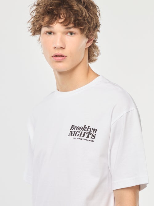 Effen T-shirt met lange mouw en print voor/achter - Kiabi Effen T-shirt met lange mouw en print voor/achter - Kiabi