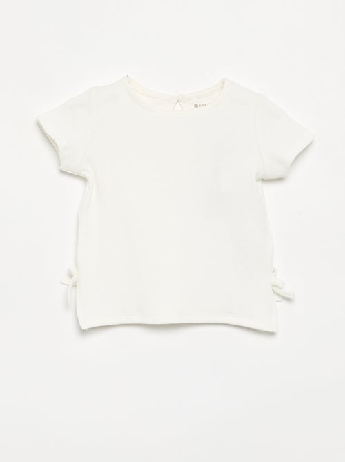 Gestreept T-shirt met korte mouwen en strikjes - Kiabi Gestreept T-shirt met korte mouwen en strikjes - Kiabi
