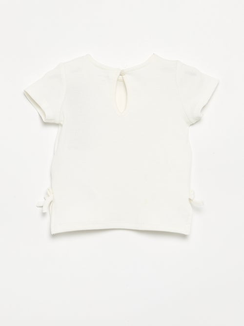 Gestreept T-shirt met korte mouwen en strikjes - Kiabi Gestreept T-shirt met korte mouwen en strikjes - Kiabi