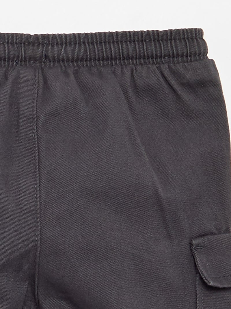 Jogg-broek van keperstof met zakken met klepje Zwart - Kiabi