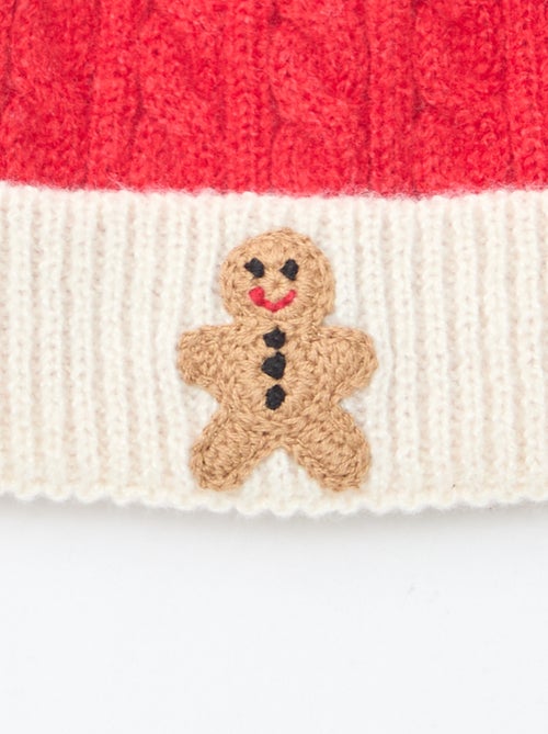 Kabelgebreide muts met ribbelpatroon en pompon - Kiabi