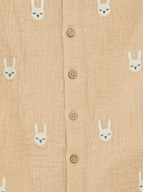 Kort speelpakje van zachte, luchtige katoen met leuke geborduurde details - Kiabi