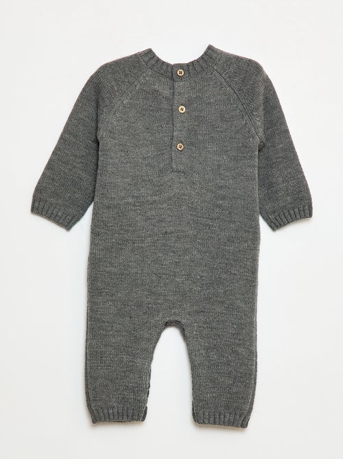 Lang, gebreid pakje met knopen op de rug - Kiabi