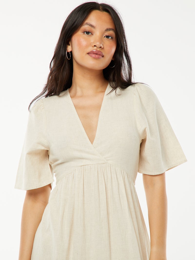 Lange jurk met volant aan de zoom en open achterkant BIEGE - Kiabi