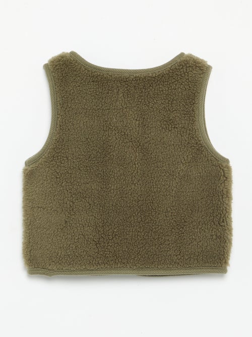 Mouwloze jas met schapenvachteffect - Kiabi Mouwloze jas met schapenvachteffect - Kiabi