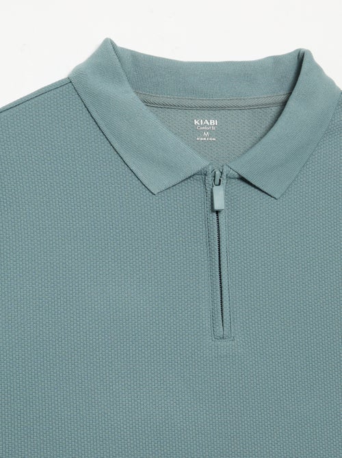 Polo van gewafelde stof met ritskraag - Kiabi Polo van gewafelde stof met ritskraag - Kiabi