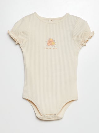 Rompertje van ribtricot met bloemmotief