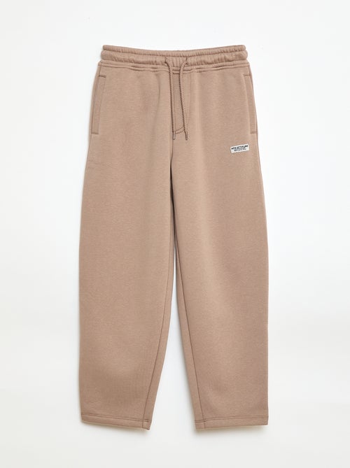 Sporttraining in ruimvallende joggingstof - Kiabi