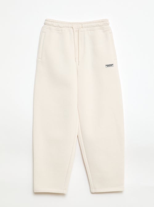 Sporttraining in ruimvallende joggingstof - Kiabi