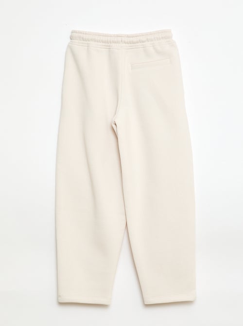 Sporttraining in ruimvallende joggingstof - Kiabi