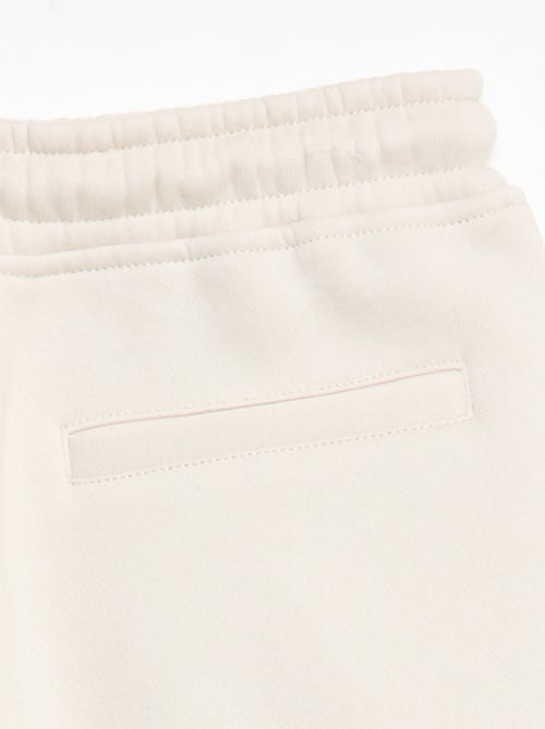 Sporttraining in ruimvallende joggingstof - Kiabi