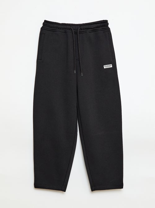 Sporttraining in ruimvallende joggingstof - Kiabi