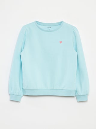 Sweater van joggingstof met borduursel en fronsjes op de schouder