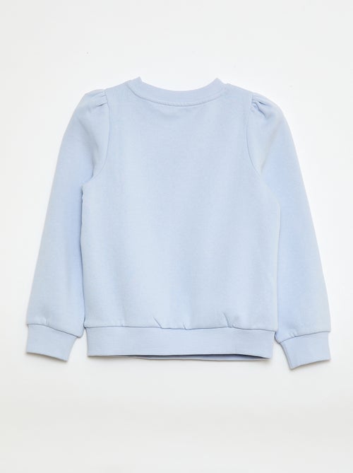 Sweater van joggingstof met borduursel en fronsjes op de schouder - Kiabi Sweater van joggingstof met borduursel en fronsjes op de schouder - Kiabi