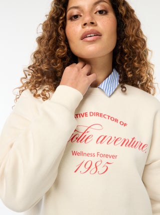 Sweater van joggingstof met opschrift