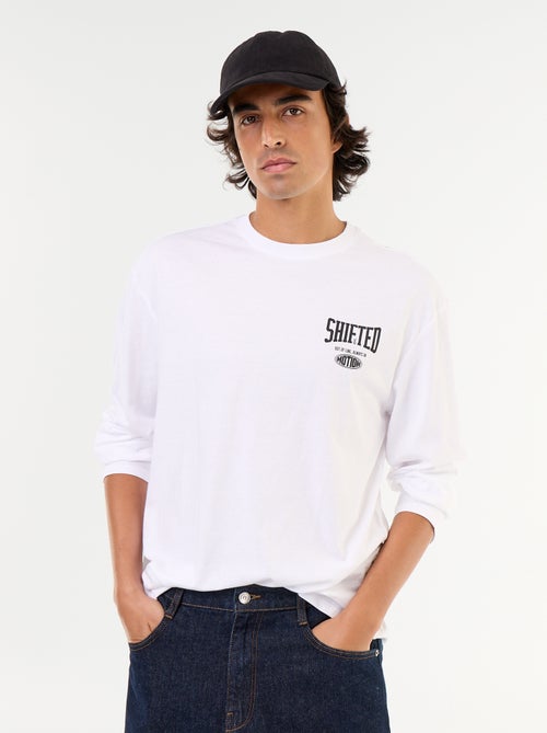 T-shirt met korte mouwen en dubbelzijdige print - Kiabi T-shirt met korte mouwen en dubbelzijdige print - Kiabi