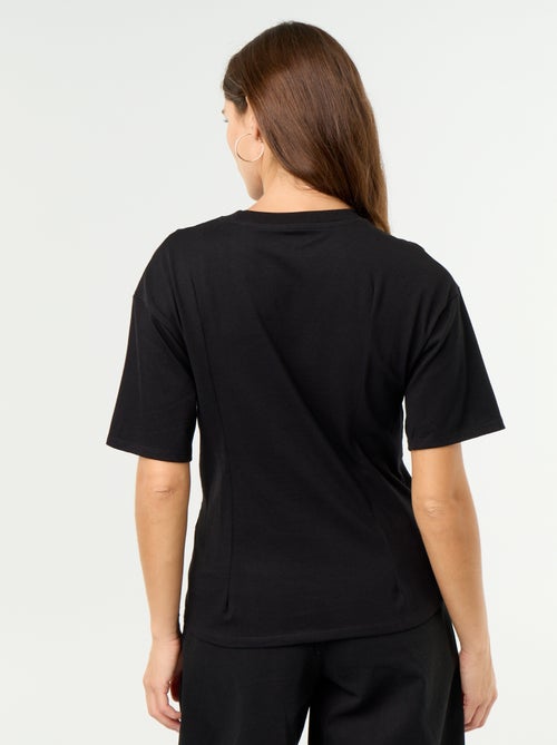 T-shirt met korte mouwen en goudkleurige schelp - Kiabi T-shirt met korte mouwen en goudkleurige schelp - Kiabi