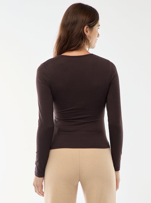 T-shirt met lange mouwen en goudkleurig sieraad vooraan met twisteffect - Kiabi