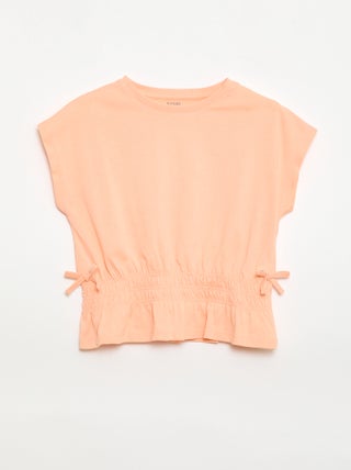 T-shirt met smocktaille en strikjes aan de taille