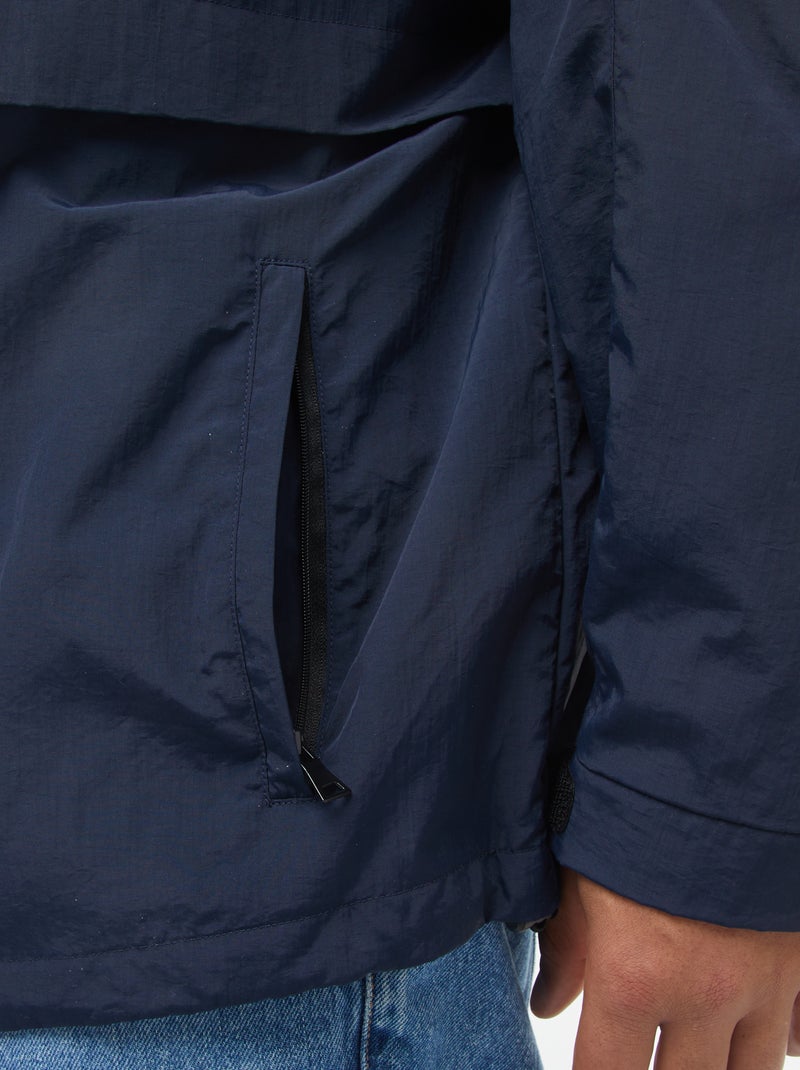 Waterdicht windjack met capuchon en afneembare mouwen Blauw - Kiabi