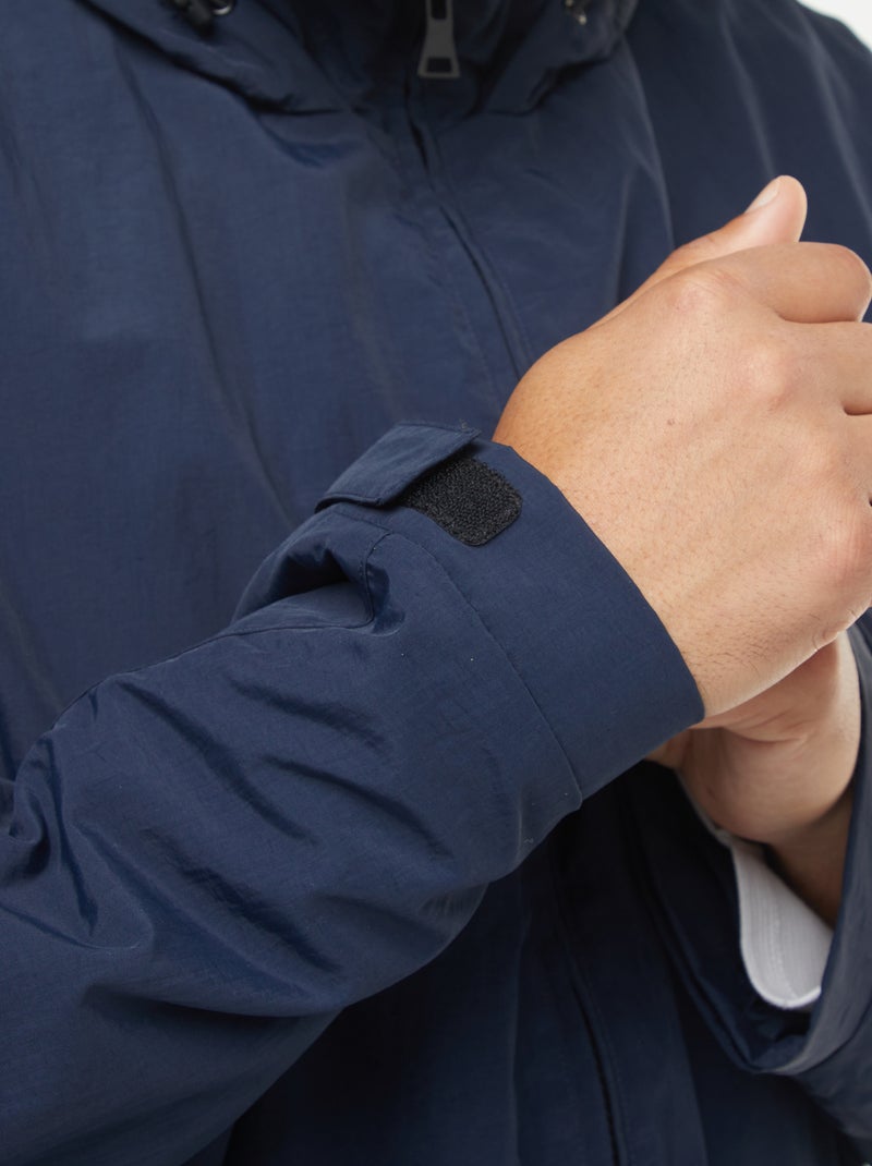 Waterdicht windjack met capuchon en afneembare mouwen Blauw - Kiabi