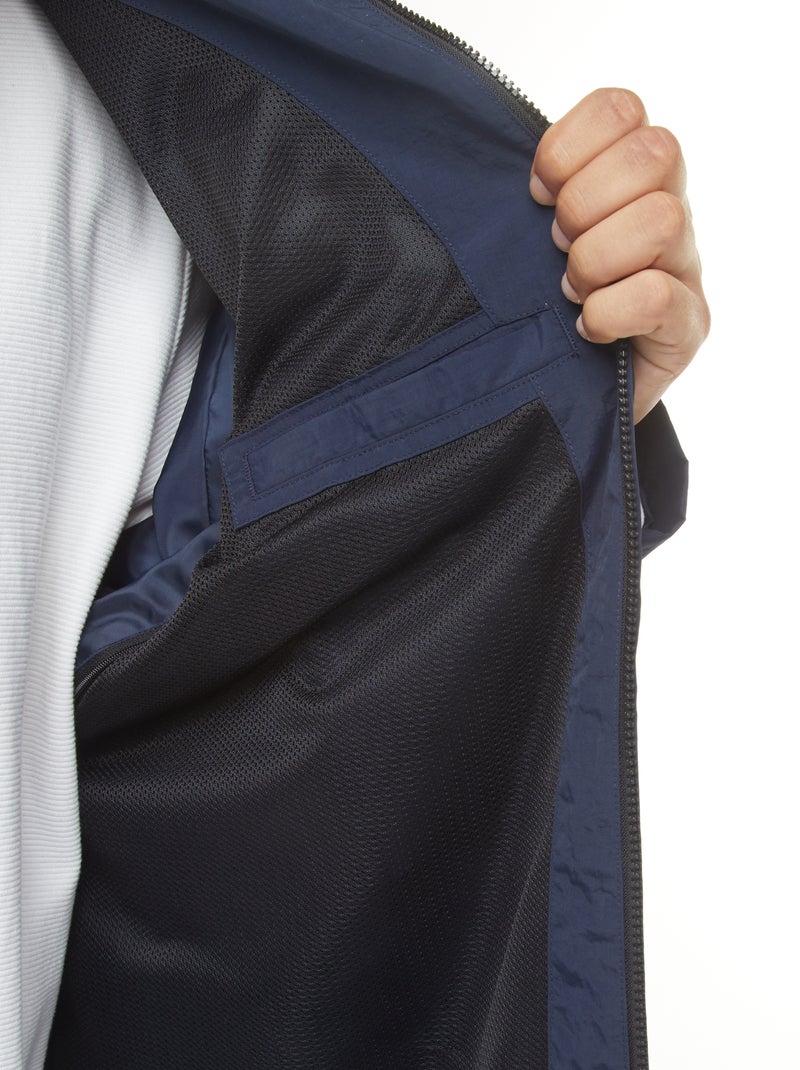 Waterdicht windjack met capuchon en afneembare mouwen Blauw - Kiabi