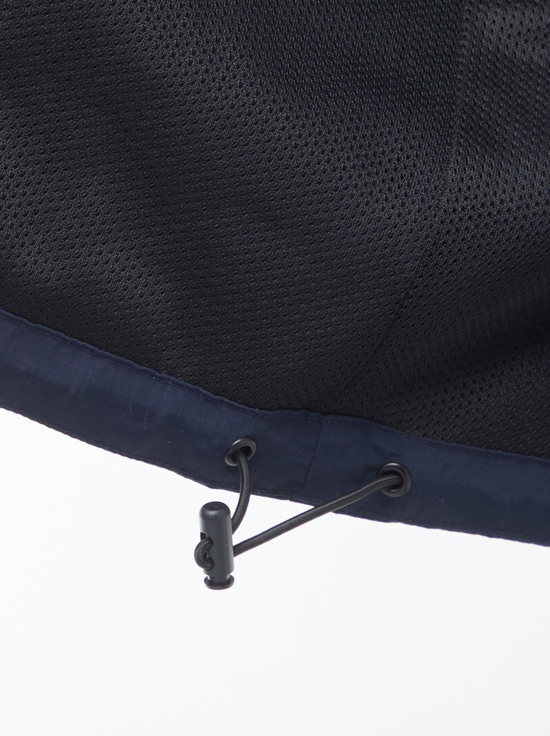 Waterdicht windjack met capuchon en afneembare mouwen Blauw - Kiabi