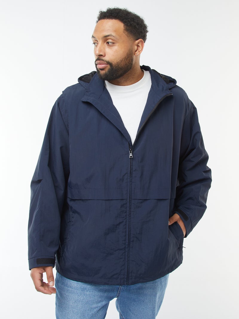 Waterdicht windjack met capuchon en afneembare mouwen Blauw - Kiabi