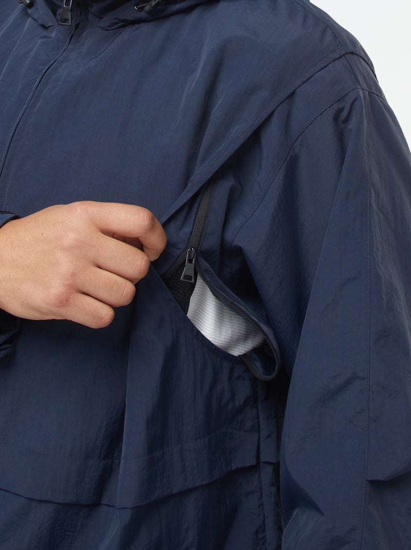 Waterdicht windjack met capuchon en afneembare mouwen Blauw - Kiabi