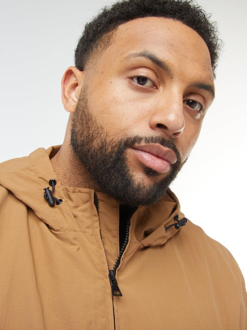 Waterdicht windjack met capuchon en afneembare mouwen - Kiabi