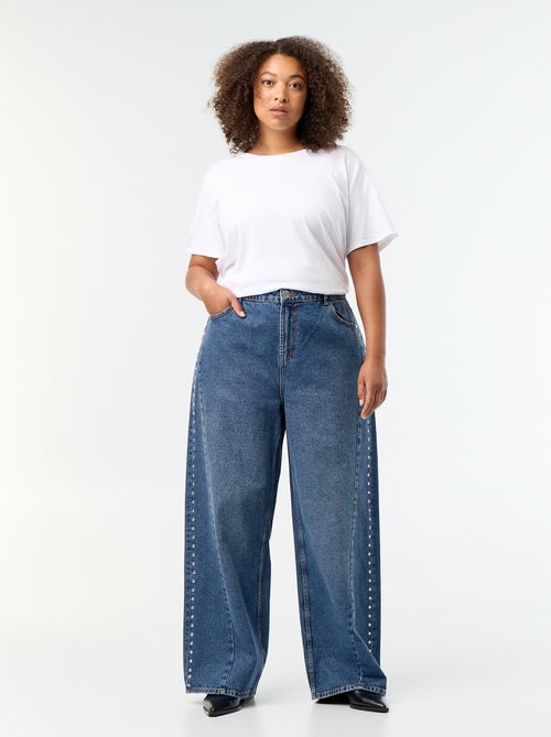 Wide leg jeans met fantasie uitsnijdingen en studs - Kiabi Wide leg jeans met fantasie uitsnijdingen en studs - Kiabi
