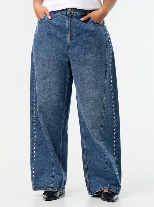 Wide leg jeans met fantasie uitsnijdingen en studs - Kiabi Wide leg jeans met fantasie uitsnijdingen en studs - Kiabi