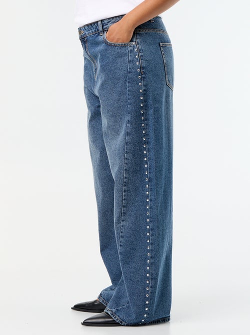 Wide leg jeans met fantasie uitsnijdingen en studs - Kiabi Wide leg jeans met fantasie uitsnijdingen en studs - Kiabi