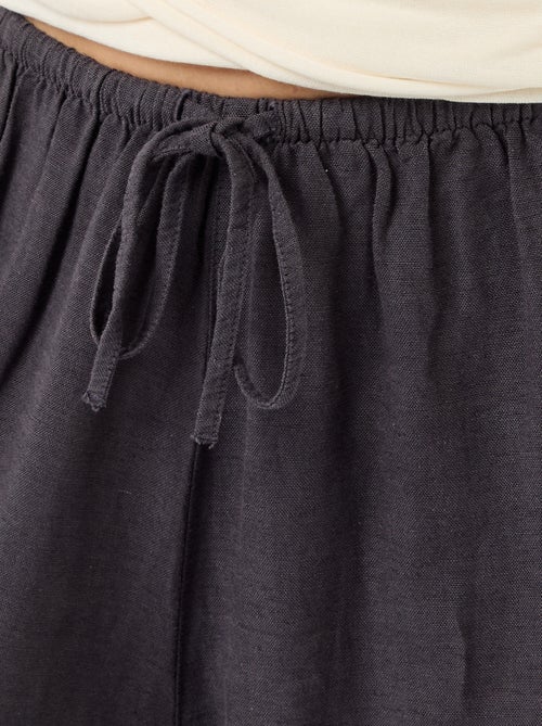 Wijde broek met elastische taille en aansnoerbare onderkant - Kiabi