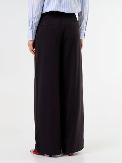 Wijde broek met hoge taille en plooien - Kiabi Wijde broek met hoge taille en plooien - Kiabi