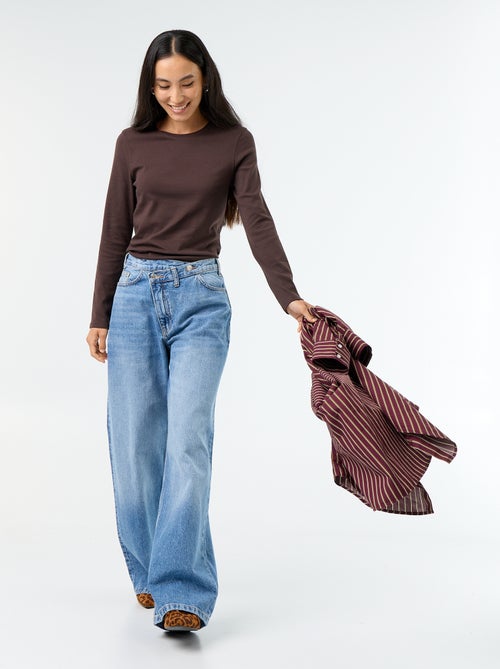 Wijde jeans met asymmetrische knoopsluiting - Kiabi Wijde jeans met asymmetrische knoopsluiting - Kiabi