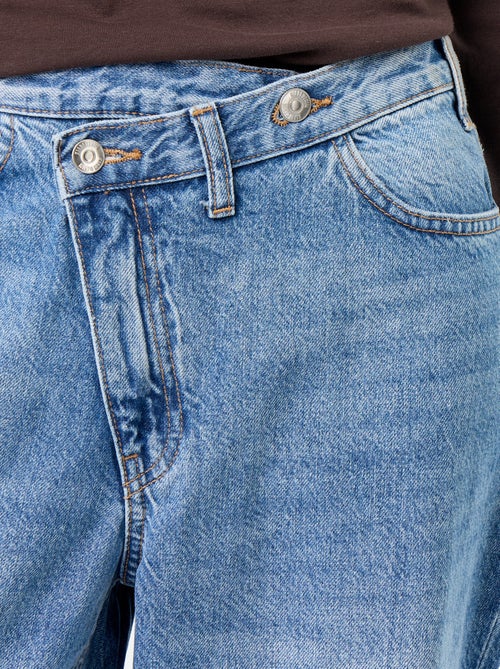 Wijde jeans met asymmetrische knoopsluiting - Kiabi Wijde jeans met asymmetrische knoopsluiting - Kiabi