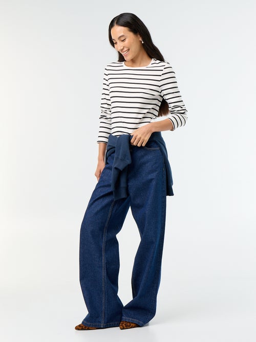 Wijde jeans met asymmetrische knoopsluiting - Kiabi Wijde jeans met asymmetrische knoopsluiting - Kiabi