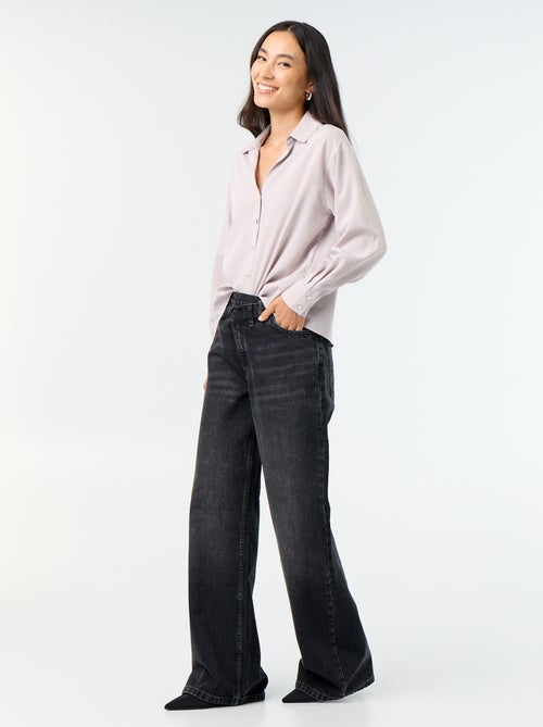 Wijde jeans met asymmetrische knoopsluiting - Kiabi Wijde jeans met asymmetrische knoopsluiting - Kiabi