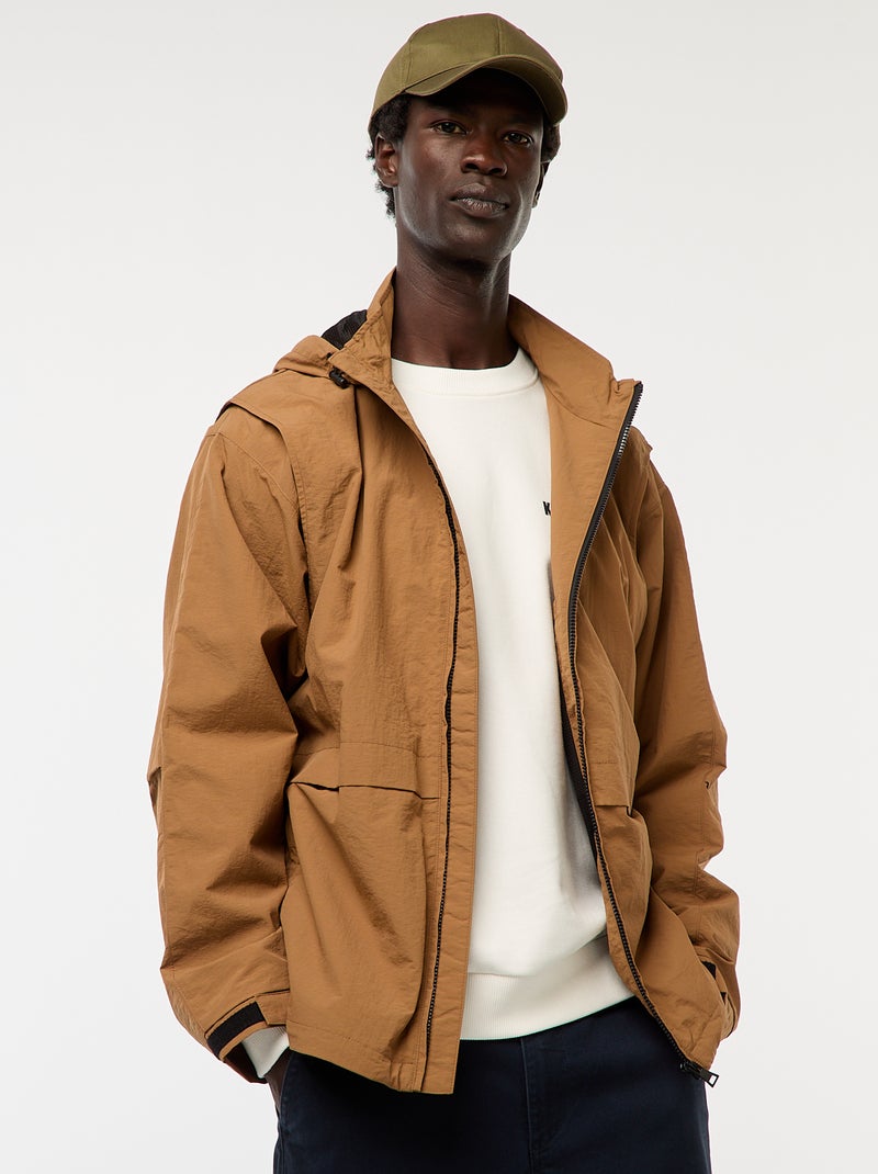Windjack met capuchon en afneembare mouwen Bruin - Kiabi